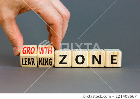 Learning or growth zone symbol. Concept words Learning zone Growth zone on wooden cubes. Beautiful grey table grey background. Psychologist hand. Business learning or growth zone concept. Copy space. Learning or growth zone symbol. Concept words Learning zone Growth zone on wooden cubes. Beautiful grey table grey background. Psychologist hand. Business learning or growth zone concept. Copy space. 121409667