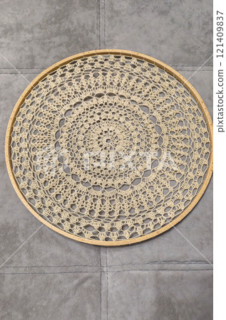 Crochet napkin on a wooden frame. Mandala with different patterns Decor Handmade 121409837
