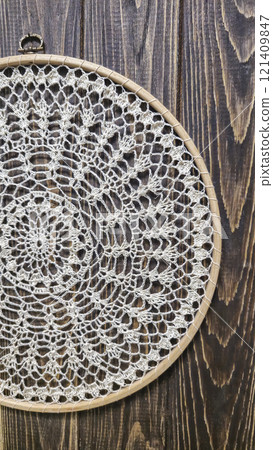 Crochet napkin on a wooden frame. Mandala with different patterns Decor Handmade 121409847