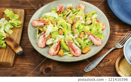 Seafood salad with shrimps and mussels on plate. 121410396