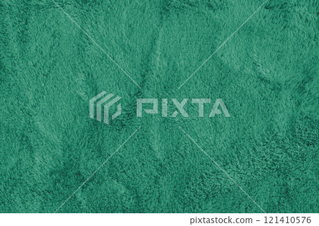 Soft fluffy green carpet texture, synthetic textile fur, plush background 121410576