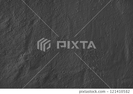 Textured black plaster wall surface with brushstroke, painted, aged concrete background 121410582