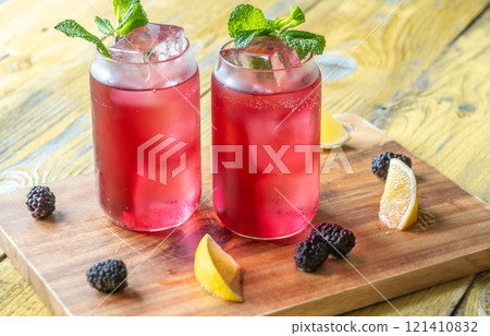 Blackberry Fizz Mocktail with mint, lime, and honey for a refreshing sip Blackberry Fizz Mocktail with mint, lime, and honey for a refreshing sip 121410832