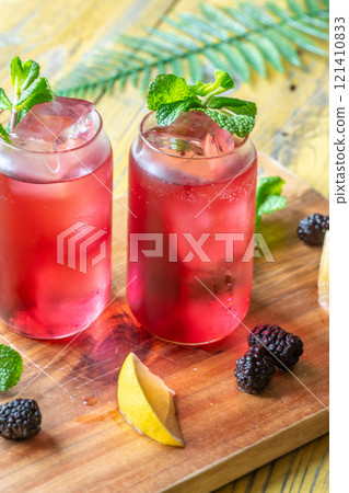 Blackberry Fizz Mocktail with mint, lime, and honey for a refreshing sip Blackberry Fizz Mocktail with mint, lime, and honey for a refreshing sip 121410833