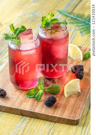 Blackberry Fizz Mocktail with mint, lime, and honey for a refreshing sip Blackberry Fizz Mocktail with mint, lime, and honey for a refreshing sip 121410834