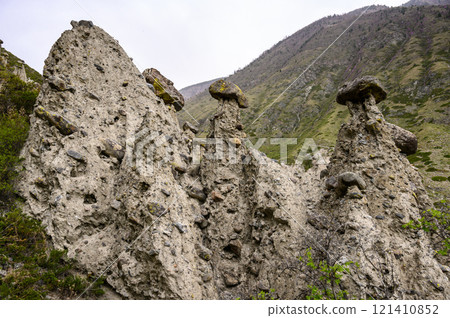 Stone mushrooms. Stone formations on the slope of a high mountain. Altai. Stone mushrooms. Stone formations on the slope of a high mountain. Altai. 121410852