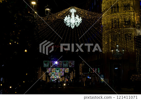 Christmas. Light. Christmas lights through the streets of Vigo. Decorating streets of the city. Fir tree with Christmas lights. Light tree. On. VIGO. SPAIN. 23 December 2024. Christmas. Light. Christmas lights through the streets of Vigo. Decorating streets of the city. Fir tree with Christmas lights. Light tree. On. VIGO. SPAIN. 23 December 2024. 121411071