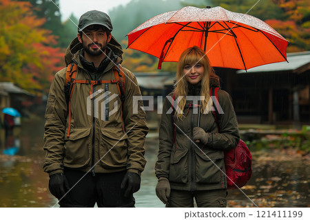 Young couple smiling brightly under the rain Young couple smiling brightly under the rain 121411199