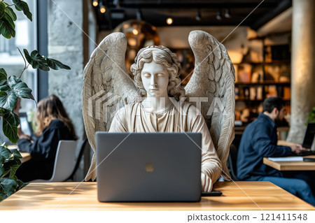 Angel statue sits at a desk with a modern laptop, surrounded by greenery and natural light. 121411548