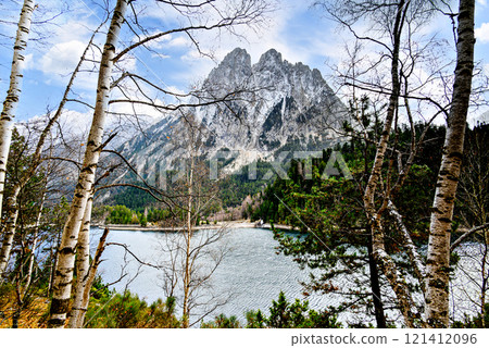Image of Sant Maurici Lake with snow-capped mountains, in the Aigues Tortes National Park, in the Lleida Pyrenees, Catalonia, Spain 121412096