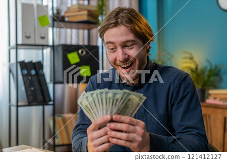 Rich businessman guy holding fan of cash money dollar banknotes showing thumbs up online income Rich businessman guy holding fan of cash money dollar banknotes showing thumbs up online income 121412127