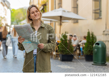 Woman traveler lost while traveling in city, exploring sightseeing map looking way destination Woman traveler lost while traveling in city, exploring sightseeing map looking way destination 121412165