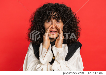 Young woman whisper news rumors holding hands near mouth, share gossip, quiet, keep my secrets Young woman whisper news rumors holding hands near mouth, share gossip, quiet, keep my secrets 121412302