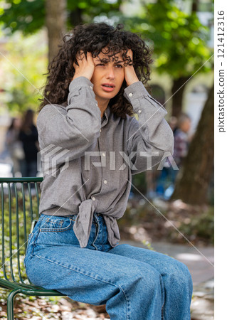 Displeased exhausted woman rubbing temples to cure headache problem suffering from tension migraine 121412316