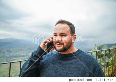 Man Cheers After a Happy Phone Call Man Cheers After a Happy Phone Call 121412642