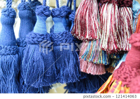 decorative brush pendants for the canopy. colored tassels made of thread for hanging on curtains. items for needlework sewing and embroidery for home comfort and window decoration. High quality photo 121414063