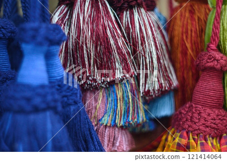 decorative brush pendants for the canopy. colored tassels made of thread for hanging on curtains. items for needlework sewing and embroidery for home comfort and window decoration. High quality photo decorative brush pendants for the canopy. colored tassels made of thread for hanging on curtains. items for needlework sewing and embroidery for home comfort and window decoration. High quality photo 121414064