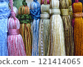 decorative brush pendants for the canopy. colored tassels made of thread for hanging on curtains. items for needlework sewing and embroidery for home comfort and window decoration. High quality photo 121414065