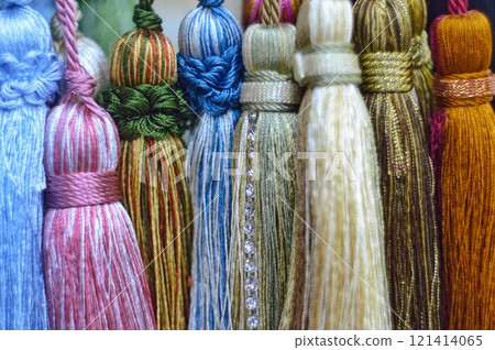decorative brush pendants for the canopy. colored tassels made of thread for hanging on curtains. items for needlework sewing and embroidery for home comfort and window decoration. High quality photo 121414065