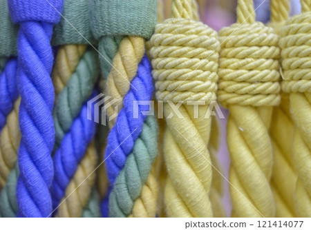 decorative brush pendants for the canopy. colored tassels made of thread for hanging on curtains. items for needlework sewing and embroidery for home comfort and window decoration. High quality photo 121414077