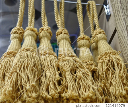 decorative brush pendants for the canopy. colored tassels made of thread for hanging on curtains. items for needlework sewing and embroidery for home comfort and window decoration. High quality photo 121414079