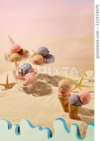 A miniature summer beach with a sunset background, an overhead view shows a blank space for displaying a product, next to some glassware containing ice cream balls with seashells, on a sand surface. 121414976