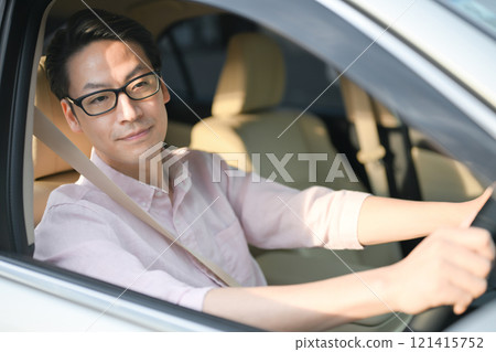 A man driving A man driving 121415752