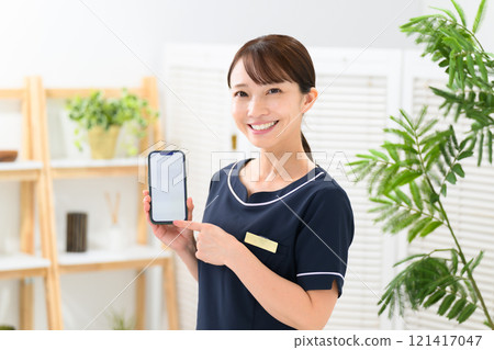 Esthetician, uniform, smartphone Esthetician, uniform, smartphone 121417047