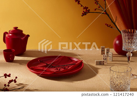 Luxury new year decoration table photograph was taken from high angle. Twinkle golden table contains some Tet-themed decorative items and a blank dish in center for product featuring Luxury new year decoration table photograph was taken from high angle. Twinkle golden table contains some Tet-themed decorative items and a blank dish in center for product featuring 121417240