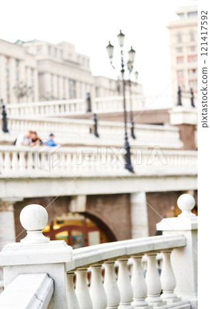 Beautiful White marble balusters on Manezhnaya Square in Moscow. Blurred background. The urban landscape. Beautiful White marble balusters on Manezhnaya Square in Moscow. Blurred background. The urban landscape. 121417592