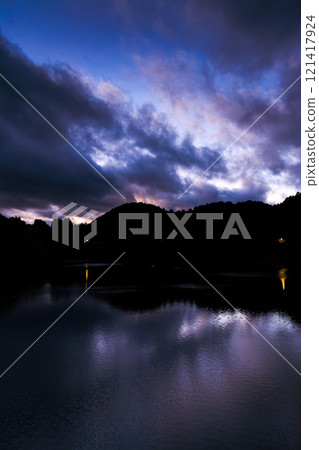 2024: Midwinter evening at Nunome Dam - The lake reflecting the sky and the blue hour sky deepening 121417924