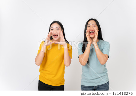 Young cheerful two Asian female friends excited screaming sharing hot news. 121418276