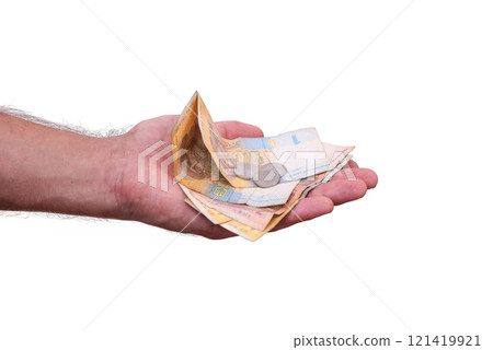 Ukrainian hryvnia and coins in your hand. isolated.  121419921