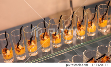 A contemporary hotel dining area featuring a sleek buffet setup. 121420115