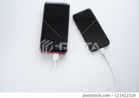 Charge your smartphone with a mobile battery 121422526