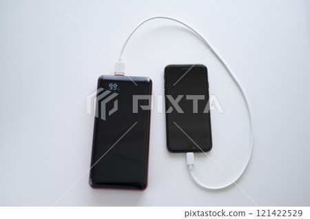 Charge your smartphone with a mobile battery 121422529