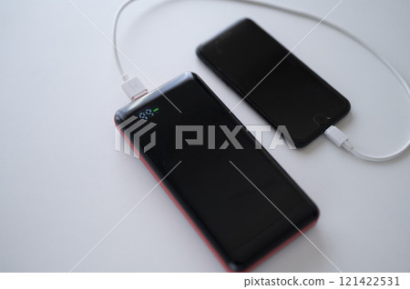 Charge your smartphone with a mobile battery Charge your smartphone with a mobile battery 121422531