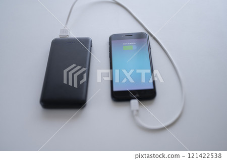 Charge your smartphone with a mobile battery 121422538