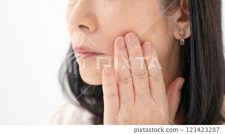 Senior woman, sagging cheeks 121423287