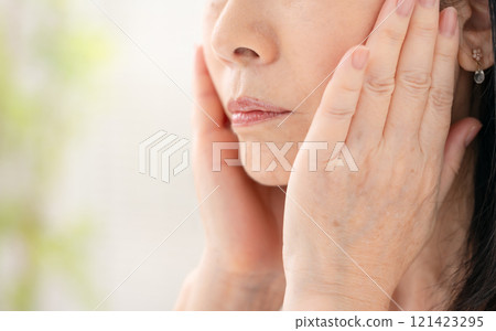Senior woman, sagging cheeks Senior woman, sagging cheeks 121423295