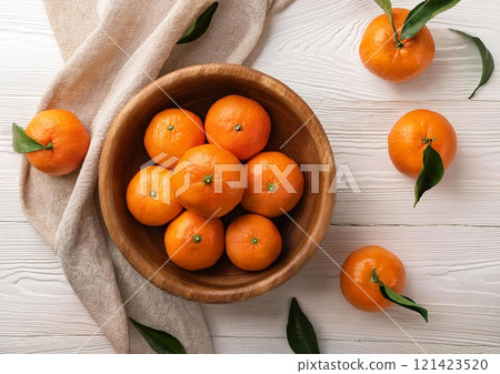 Mandarins in a wooden container 121423520