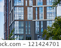 Facade of a modern residential building, building texture 121424701