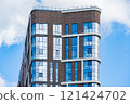 Facade of a modern residential building, building texture 121424702