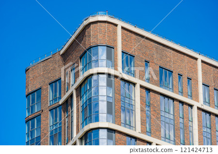 Facade of a modern residential building, building texture 121424713