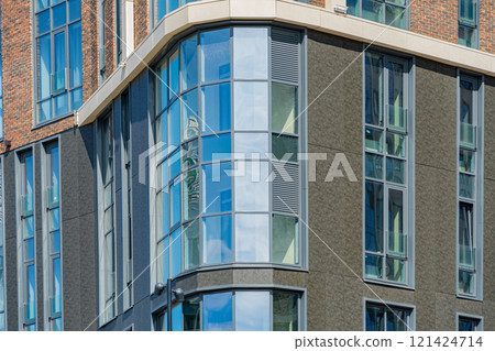 Facade of a modern residential building, building texture 121424714