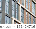 Facade of a modern residential building, building texture 121424716