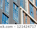 Facade of a modern residential building, building texture 121424717