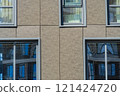 Facade of a modern residential building, building texture 121424720