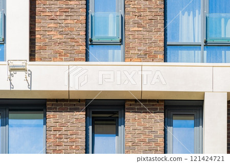 Facade of a modern residential building, building texture 121424721