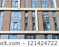 Facade of a modern residential building, building texture 121424722
